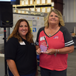 Ruthie Mosser posed with the 2024 Tina Bridges Excellence in Service award standing next to Ann Pollock